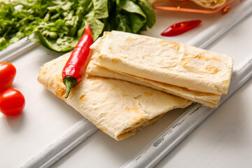 Fresh lavash on white wooden background
