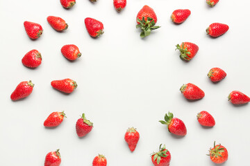 Frame made of fresh strawberries on white background