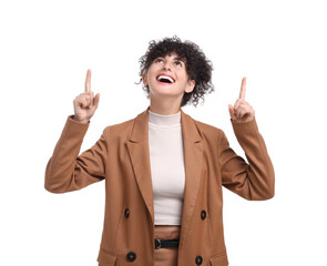 Beautiful happy businesswoman pointing at something on white background