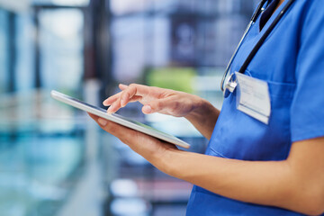 Nurse, hands and tablet, woman scroll through digital healthcare information and technology. Female...