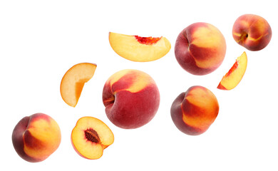 Cut and whole fresh ripe peaches falling on white background