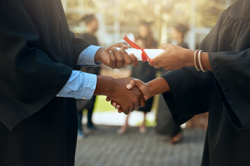 Handshake, graduation and hands with certificate at a college for education or scholarship. Support, thank you and a university graduate shaking hands with a teacher for certification and achievement
