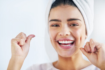 Portrait, happy and woman with floss, dental and oral health with happiness, cosmetics and fresh breath. Face, female person or girl in a bathroom, cleaning or self care with morning routine or teeth