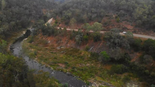 Aerial shot moving forward along the tambo river and the great alpine road in Victoria.