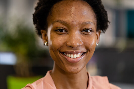 Closeup portrait of african american businesswoman smiling and posing in office
