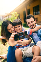 Fototapeta premium Happy family, relax and smile for selfie, profile picture or photo in social media vlog outside home. Mother, father and child smiling for fun memory, online post or holiday weekend break together