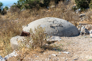 A military bunker guards the hills surrounding Saranda, Albania - 602854407