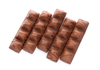 Many tasty chocolate bars isolated on white, top view
