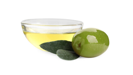 Cooking oil in glass bowl, olive and leaves on white background
