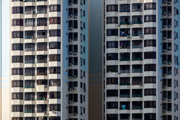 Crowded living in Condominium. Urban living. Residential condominium building exterior.