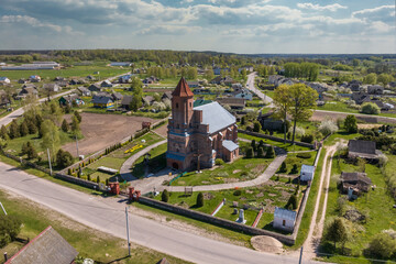 Fototapeta na wymiar aerial view on neo gothic temple or catholic church in countryside
