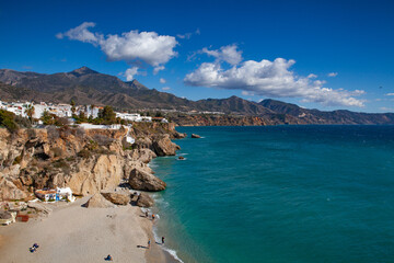 Typical small stony beaches in the city of Nerja, Spain