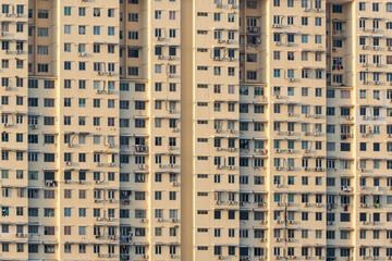 Exterior of compact residential building. Exterior architecture. Low cost residential building outlook. Low cost living condition. Urban poverty.