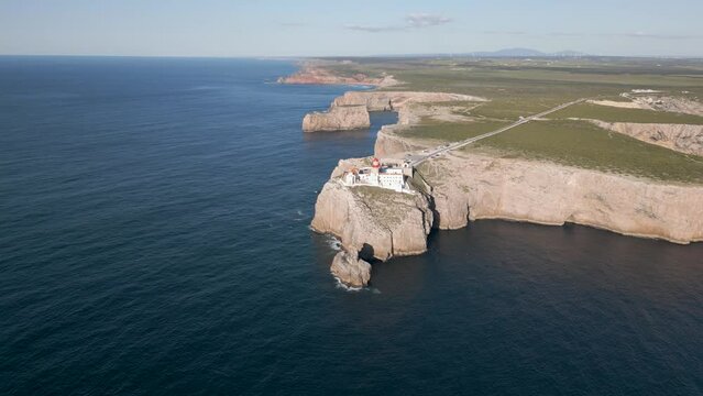 Circular drone images show the 75 meter high cliffs of Cabo de São Vicente in Portugal.