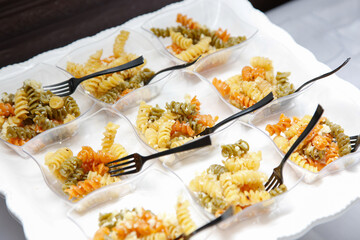 A view of a catered platter of pasta salad.