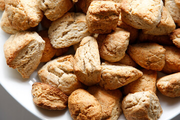 A top down view of a catered bowl full of mini scones.