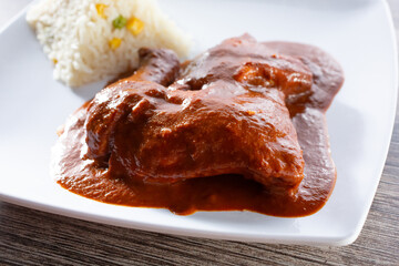A view of a plate of mole coloradito.