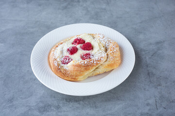 A view of a raspberry cheesecake danish pastry.
