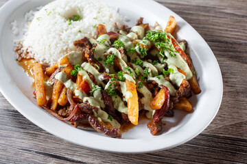 A view of a plate of lomo saltado.