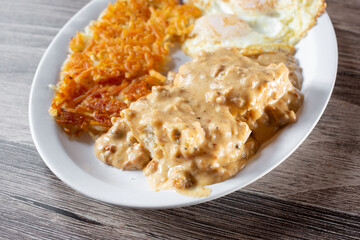 A view of biscuits and gravy breakfast plate.