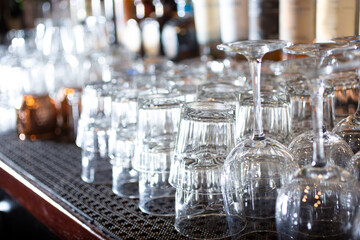A view of a counter full of clean cocktail glasses.