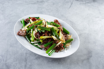 A view of a plate of Mongolian beef.