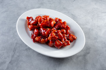 A view of a plate of orange chicken.