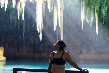  Woman in a cenote cave in Mexico 