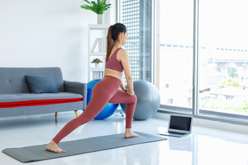Asian beautiful healthy fit slim sexy female sporty athlete model in sports bra and leggings...