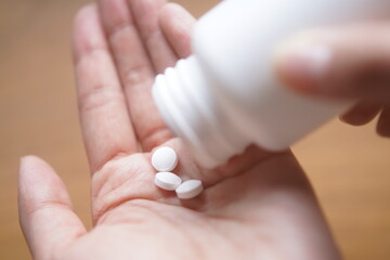 person holding pills Medical Medicine Health Care Hospital Tools Tablets Phymacy Vitamins protect sick medical care vaccine, virus, vaccination, treatment, sleeping pill, injections