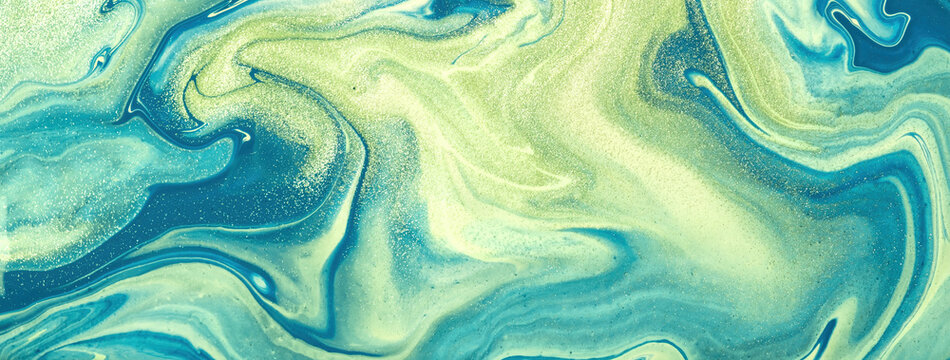 Abstract fluid art background blue and green color. Liquid marble. Acrylic painting with turquoise glitter and gradient.