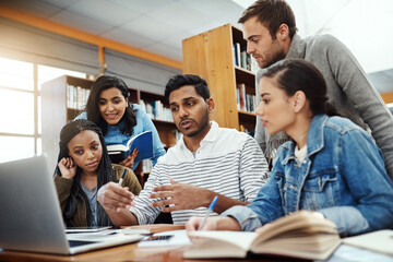 Computer, talking and students studying in a library for a group project, teamwork and education....