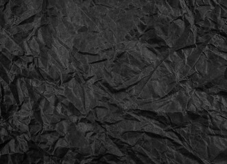 Black crumpled paper texture pattern. Rough grunge old blank.