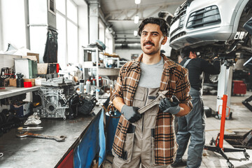 Portrait of a male mechanic in an auto repair shop