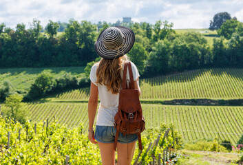 Traveler woman in green vineyard in France, Agri tourism tour of Bordeaux region