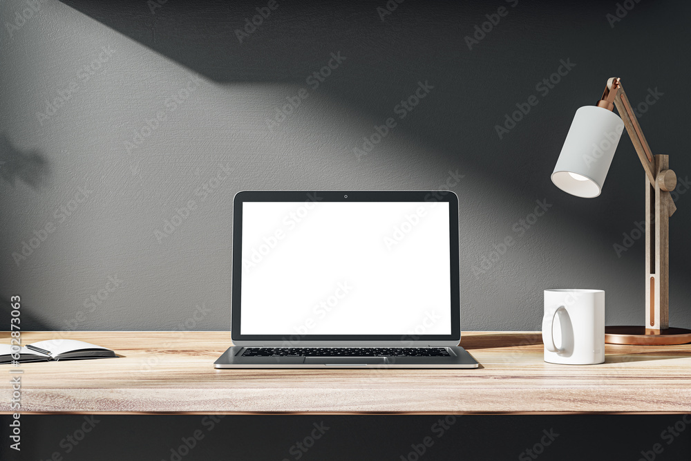 Poster Front view on blank white modern laptop monitor with space for web design, website or landing page on wooden work table with coffee mug and sunlit black wall background. 3D rendering, mock up
