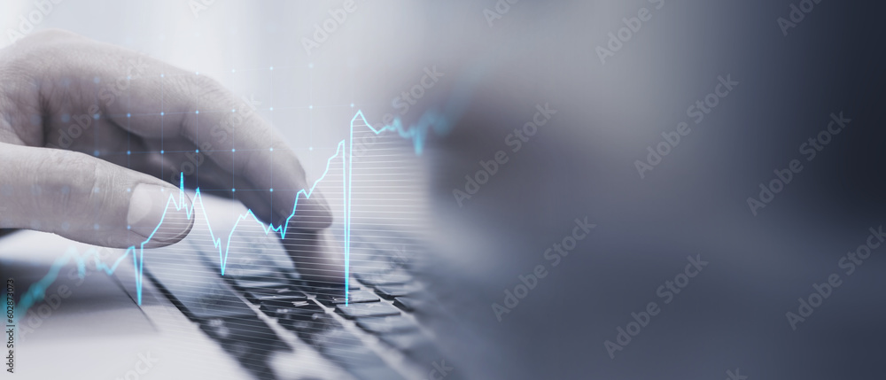 Poster close up of male hand using keyboard with glowing upward business chart on blurry wide perspective b