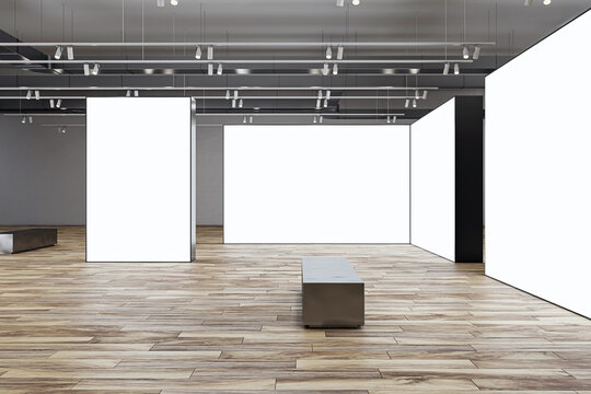 Side view on metallic bench in front of white blank partitions with place for advertising poster or picture frame in exhibition hall with wooden floor and grey wall background. 3D rendering, mockup