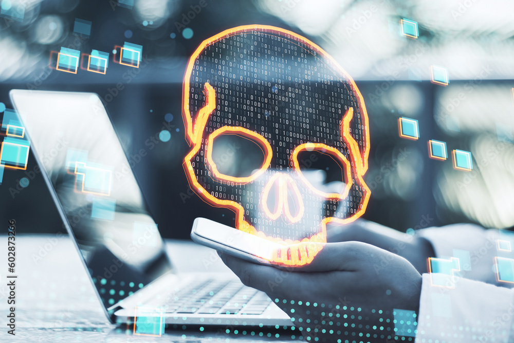Aufkleber Close up of male hands using laptop and cellphone with glowing digital binary code skull on blurry outdoor background. Hacking, piracy, malware and data theft concept. Double exposure.