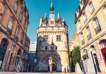 Bordeaux city,  Porte Cailhau and woman tourist,  tourism in France, Nouvelle aquitaine - obrazy, fototapety, plakaty