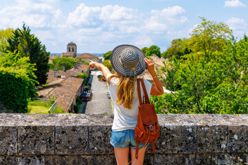 Woman tourist pointing Blaye city view- France,  Nouvelle aquitaine