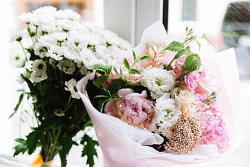 A Fresh and Colorful Floral Bouquet A beautiful bouquet of fresh pink flowering plants arranged in a unique floral design, perfect for any occasion