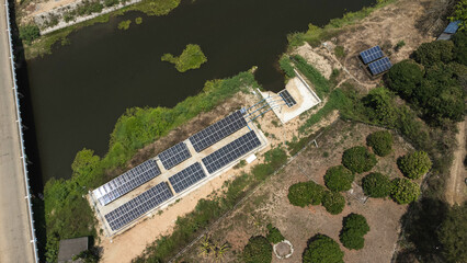 Top view on photovoltaic solar power panels. Drone aerial view of solar panels with water pumps,...