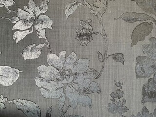 floral silver background with flowers on fabric texture