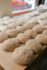 Fototapeta na wymiar Loaf-shaped bread dough on the table