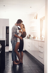 Fototapeta na wymiar Love, passionate and a couple kissing in the kitchen of their home together in the morning for romance. Kiss, passion or sexy with a man and woman bonding in a house during an intimate moment
