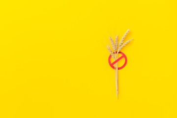 crossed spikelet symbol on yellow . Celiac disease. Gluten intolerance.