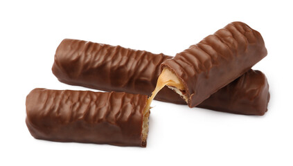 Sweet tasty chocolate bars with caramel on white background