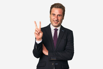 A middle-aged businessman isolated showing number two with fingers.