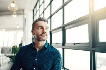Thinking, startup and man at office window, creative ideas for business project or entrepreneur at...